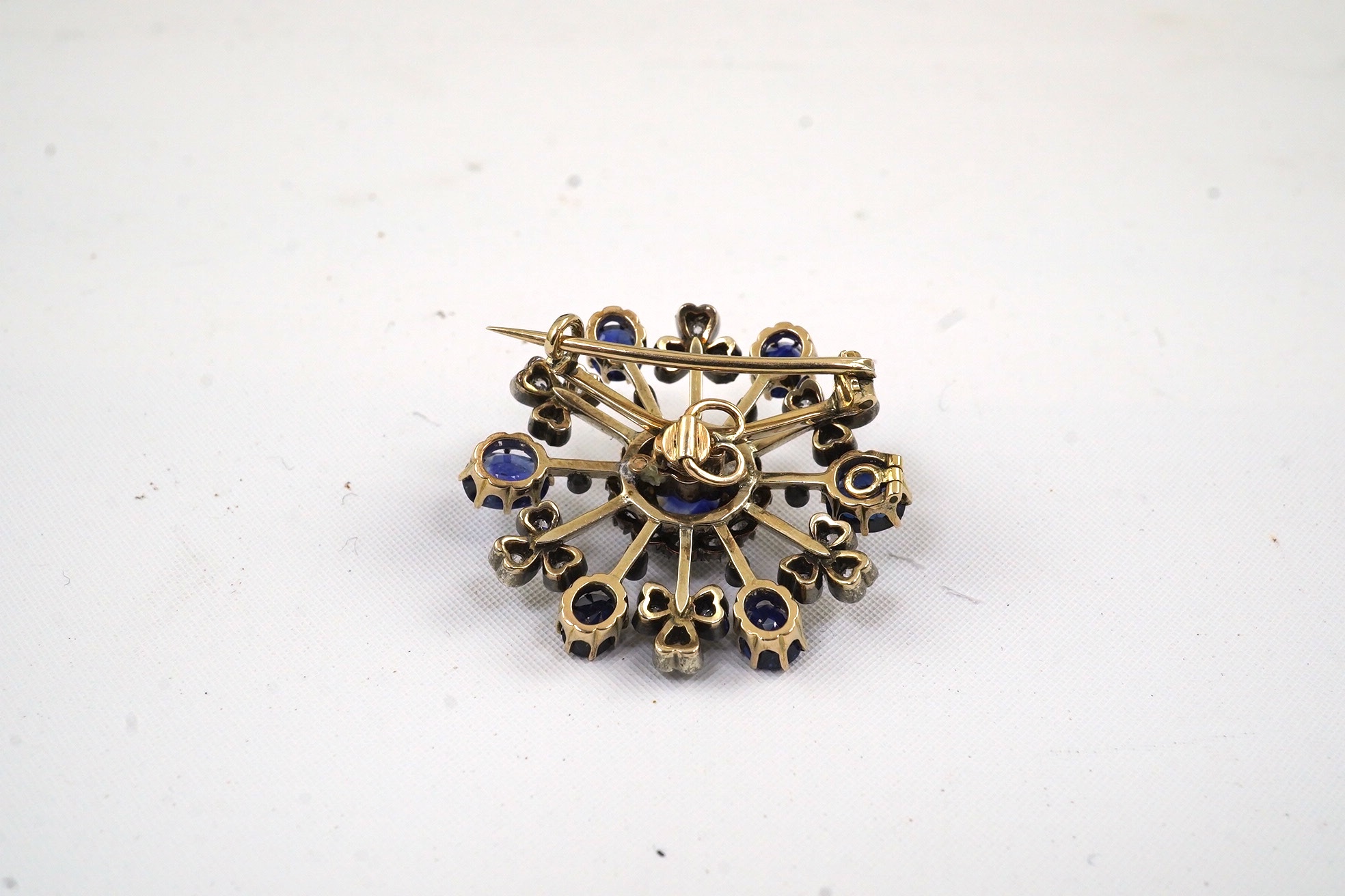 A late Victorian gold, sapphire and diamond cluster brooch